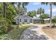 Well-landscaped front yard with palm trees enhancing curb appeal at 1406 Glencoe Dr, Mount Pleasant, SC 29464