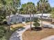 Charming exterior with palm trees and a circular driveway enhances curb appeal at 1406 Glencoe Dr, Mount Pleasant, SC 29464