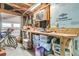 Organized garage with workbench, storage bins, and overhead lighting at 1406 Glencoe Dr, Mount Pleasant, SC 29464