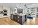 Spacious kitchen with an island, wooden floors, stainless steel appliances and white cabinets for a clean, modern design at 1406 Glencoe Dr, Mount Pleasant, SC 29464