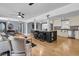 An airy living room connects to a modern kitchen with stainless appliances at 1406 Glencoe Dr, Mount Pleasant, SC 29464