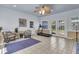 Bright sunroom with tile floors, ceiling fan, exercise equipment, and French doors to the backyard at 1406 Glencoe Dr, Mount Pleasant, SC 29464