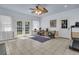 Spacious sunroom featuring tile floors, French doors, and a view of the well-manicured backyard at 1406 Glencoe Dr, Mount Pleasant, SC 29464