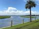 Stunning water view with palm trees and a bridge in the distance, showcasing the beauty of the coastal location at 1406 Glencoe Dr, Mount Pleasant, SC 29464