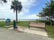 Picturesque waterfront with a bench, drinking fountain, and statue, offering a relaxing spot with views of the water at 1406 Glencoe Dr, Mount Pleasant, SC 29464