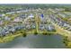 Aerial view of a neighborhood with serene lakes and lush landscaping, showcasing community living at 1445 Lettered Olive Ln, Mount Pleasant, SC 29464