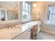 Bright bathroom with double vanity, marble counters, and a separate shower area at 1445 Lettered Olive Ln, Mount Pleasant, SC 29464