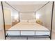 Bedroom with canopy bed, neutral decor, and wood nightstands for a calm, inviting atmosphere at 1445 Lettered Olive Ln, Mount Pleasant, SC 29464