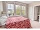 Bright bedroom featuring a large window with views of the outdoors and light carpet at 1445 Lettered Olive Ln, Mount Pleasant, SC 29464