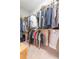 Spacious walk-in closet with double rods and shelves for organized clothing storage at 1445 Lettered Olive Ln, Mount Pleasant, SC 29464