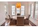 Comfortable dining space featuring a round table set with upholstered chairs and natural light at 1445 Lettered Olive Ln, Mount Pleasant, SC 29464
