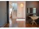 Inviting entryway with hardwood floors, staircase access, and views into other living spaces at 1445 Lettered Olive Ln, Mount Pleasant, SC 29464