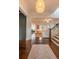 Inviting foyer boasts hardwood floors, natural light, and an open view into the living room at 1445 Lettered Olive Ln, Mount Pleasant, SC 29464