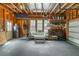 An organized garage with wood walls and black rubber flooring at 1445 Lettered Olive Ln, Mount Pleasant, SC 29464