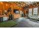 A converted garage with wood framing, black rubber floor, and a golf simulator at 1445 Lettered Olive Ln, Mount Pleasant, SC 29464