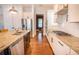 Modern kitchen features stainless steel appliances, granite countertops, and ample cabinet space at 1445 Lettered Olive Ln, Mount Pleasant, SC 29464