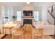 Cozy living room with fireplace, hardwood floors, and comfortable seating arrangement at 1445 Lettered Olive Ln, Mount Pleasant, SC 29464