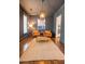 Inviting living room featuring wood floors, comfortable seating, and access to other rooms at 1445 Lettered Olive Ln, Mount Pleasant, SC 29464