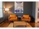 Stylish living room with leather chairs, wood floors, and modern decor for comfortable living at 1445 Lettered Olive Ln, Mount Pleasant, SC 29464