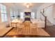 Bright living room with fireplace, hardwood floors, and comfortable seating arrangement at 1445 Lettered Olive Ln, Mount Pleasant, SC 29464