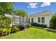 View of lush green backyard and trampoline adjacent to bright single story home at 1474 Indian St, Mount Pleasant, SC 29464