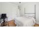 This bedroom features a soft beige bed, hardwood floors and plenty of natural light at 1474 Indian St, Mount Pleasant, SC 29464