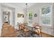 Bright dining area with built-in bench seating and a unique wooden table at 1474 Indian St, Mount Pleasant, SC 29464
