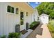 Inviting entrance featuring stylish outdoor lighting, planters and decorative stone walkway at 1474 Indian St, Mount Pleasant, SC 29464