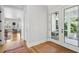 Hallway with hardwood floors and access to a sunroom at 1474 Indian St, Mount Pleasant, SC 29464