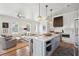 Inviting kitchen featuring a central island with seating and views into living room at 1474 Indian St, Mount Pleasant, SC 29464