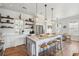 Charming kitchen with an island, pendant lighting, and stainless steel appliances at 1474 Indian St, Mount Pleasant, SC 29464