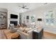 Bright and airy living room featuring a fireplace, built-in shelving, and comfortable seating at 1474 Indian St, Mount Pleasant, SC 29464