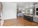 Open-concept living room connected to the kitchen, featuring hardwood floors and lots of natural light at 1474 Indian St, Mount Pleasant, SC 29464