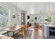 Bright open-concept living space with dining area and fireplace in a well-lit space at 1474 Indian St, Mount Pleasant, SC 29464