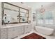 Elegant main bathroom with double vanity, soaking tub, and decorative lighting at 1474 Indian St, Mount Pleasant, SC 29464