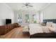 Bright main bedroom featuring hardwood floors, sitting area, and natural light at 1474 Indian St, Mount Pleasant, SC 29464