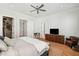 Comfortable main bedroom featuring hardwood floors, ensuite access, and closet access at 1474 Indian St, Mount Pleasant, SC 29464