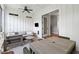 Comfortable screened porch with a flatscreen, ceiling fan, and view to inside at 1474 Indian St, Mount Pleasant, SC 29464