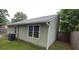 The back exterior of this home features neutral siding, replacement windows, and a well-maintained roof at 148 Lancashire Rd, Summerville, SC 29486