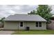 The back exterior of this home features neutral siding, replacement windows, and a well-maintained roof at 148 Lancashire Rd, Summerville, SC 29486
