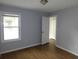Cozy bedroom with hardwood floors, a bright window, and a neutral color scheme at 148 Lancashire Rd, Summerville, SC 29486