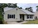 Charming home with black shutters, new windows, neutral siding, and a well-manicured front yard at 148 Lancashire Rd, Summerville, SC 29486