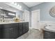 Elegant bathroom boasts a double vanity with granite countertops and stylish fixtures, offering a luxurious and functional space at 176 Clearblue Loop, Summerville, SC 29486