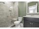 Bathroom featuring walk-in shower, gray tile, modern fixtures and a solid surface vanity at 176 Clearblue Loop, Summerville, SC 29486