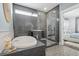 Modern bathroom featuring a soaking tub and a glass-enclosed shower, offering a luxurious and spa-like experience at 176 Clearblue Loop, Summerville, SC 29486