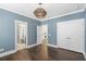 Light-filled bedroom featuring hardwood floors, neutral paint and modern lighting at 176 Clearblue Loop, Summerville, SC 29486