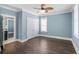 Light-filled bedroom with hardwood floors and access to an ensuite bath at 176 Clearblue Loop, Summerville, SC 29486