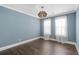 Light-filled bedroom featuring hardwood floors, neutral paint and modern lighting at 176 Clearblue Loop, Summerville, SC 29486