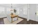 Elegant dining room with a wood table, seating for six, and natural light at 176 Clearblue Loop, Summerville, SC 29486
