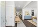 Bright foyer featuring wood floors, a bench, and views into the open living spaces at 176 Clearblue Loop, Summerville, SC 29486